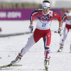 La noruega Marit Bjoergen en el momento de cruzar como campeona la línea de meta.