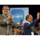 Mariano Rajoy y José Antonio Monago, en la clausura de las jornadas del PP sobre buen gobierno, este sábado en Cáceres.