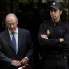 Rodrigo Rato tras declarar a la Audiencia Nacinal por el caso de las tarjetas opacas de Caja Madrid.