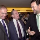 Pío García Escuredo, Rodrigo Rato y Mariano Rajoy, ayer, en Madrid