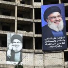 Retratos del líder de Hezbolá, Hassan Nasrallah, están colgados en un edificio en los suburbios del sur de Beirut, después del anuncio de su muerte. EFE/EPA/WAEL HAMZEH