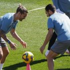 Griezmann y Koke Reusrección, durante el entrenamiento.