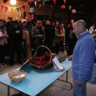 Celebración de la subasta de patas y orejas de cerdo.