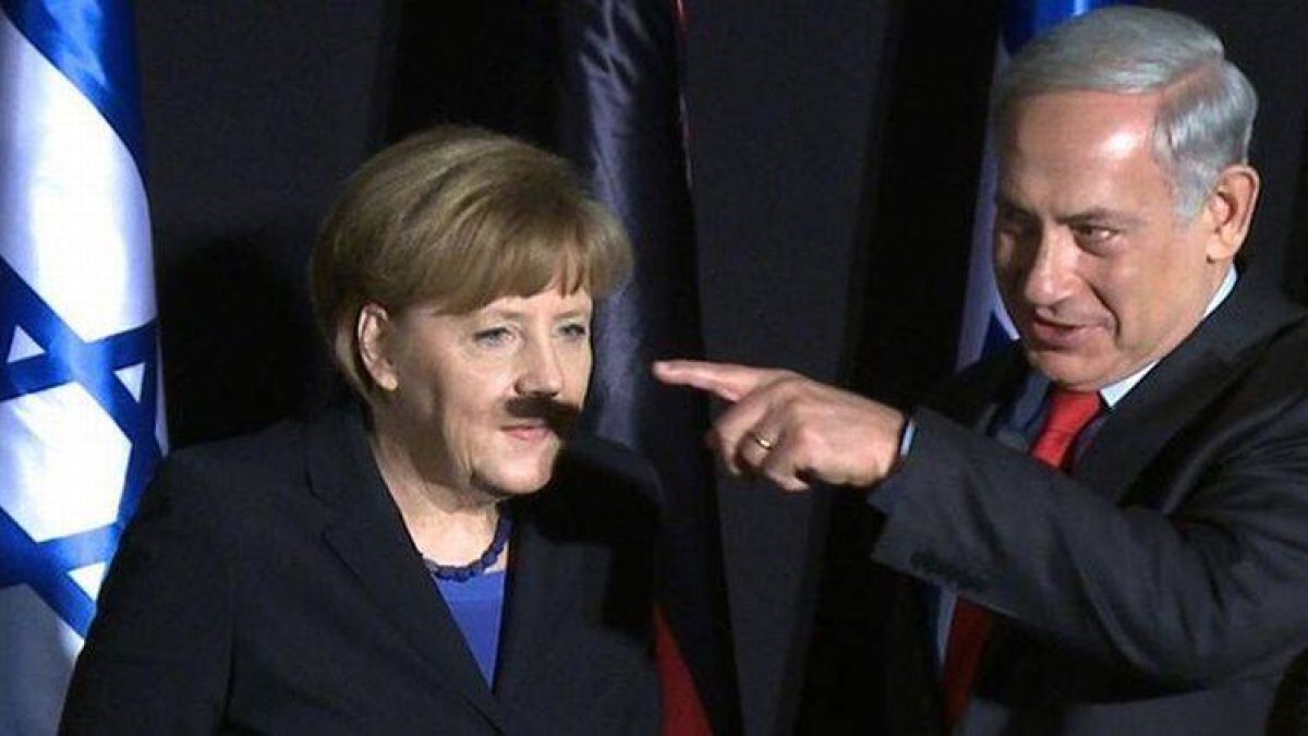 La sombra del dedo y la mano de Netanyahu, sobre el rostro de Merkel.