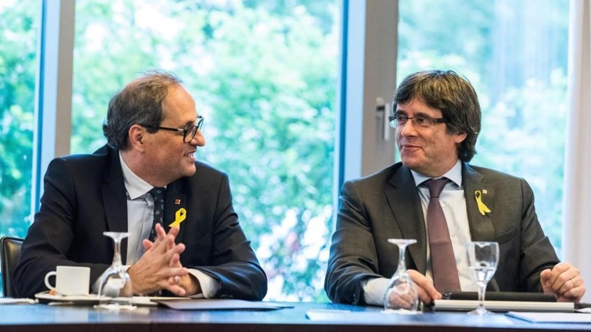 El president de la Generalitat, Quim Torra, y el expresidente Carles Puigdemont, en un encuentro en Berlín el pasado junio.
