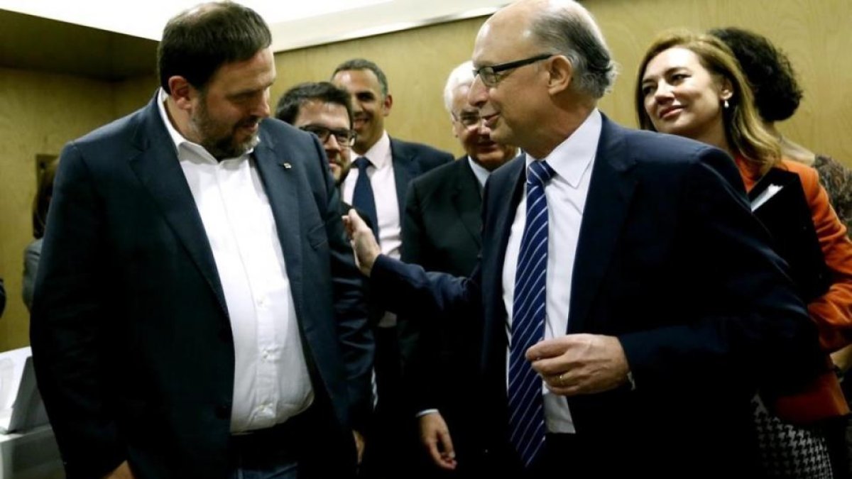 Oriol Junqueras y Cristóbal Montoro, en el Consejo de Política Fiscal y Financiera.