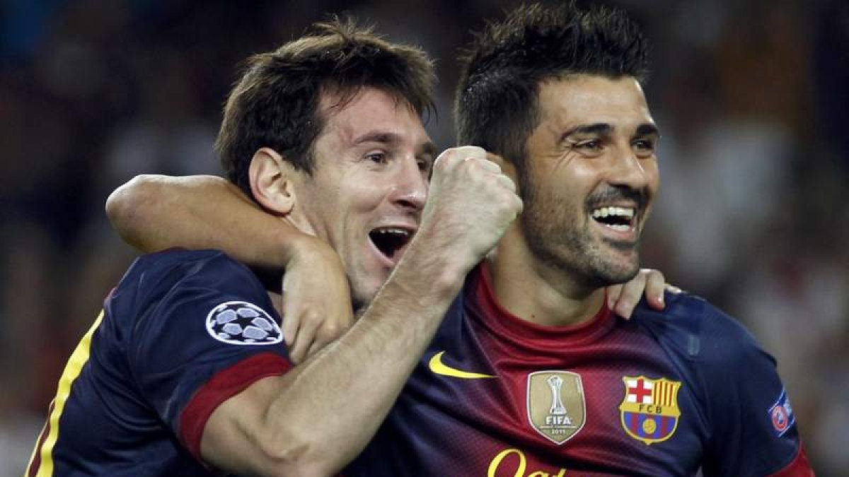 Messi celebra con Villa uno de los goles del argentino esta temporada.