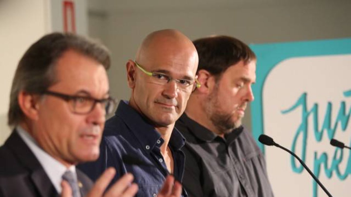 Artur Mas, Raül Romeva y Oriol Junqueras, este lunes, 21 de septiembre, en un acto de Junts pel Sí.