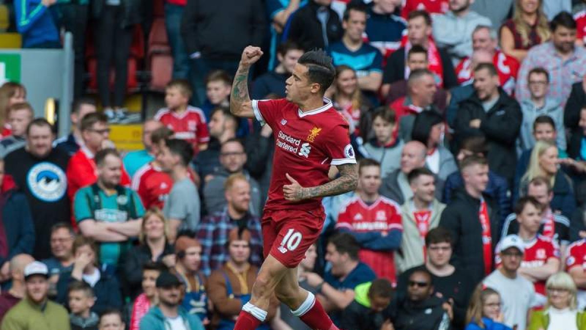 Coutinho, pretendido por el Barça, celebra un gol con el Liverpool. PETER POWELL