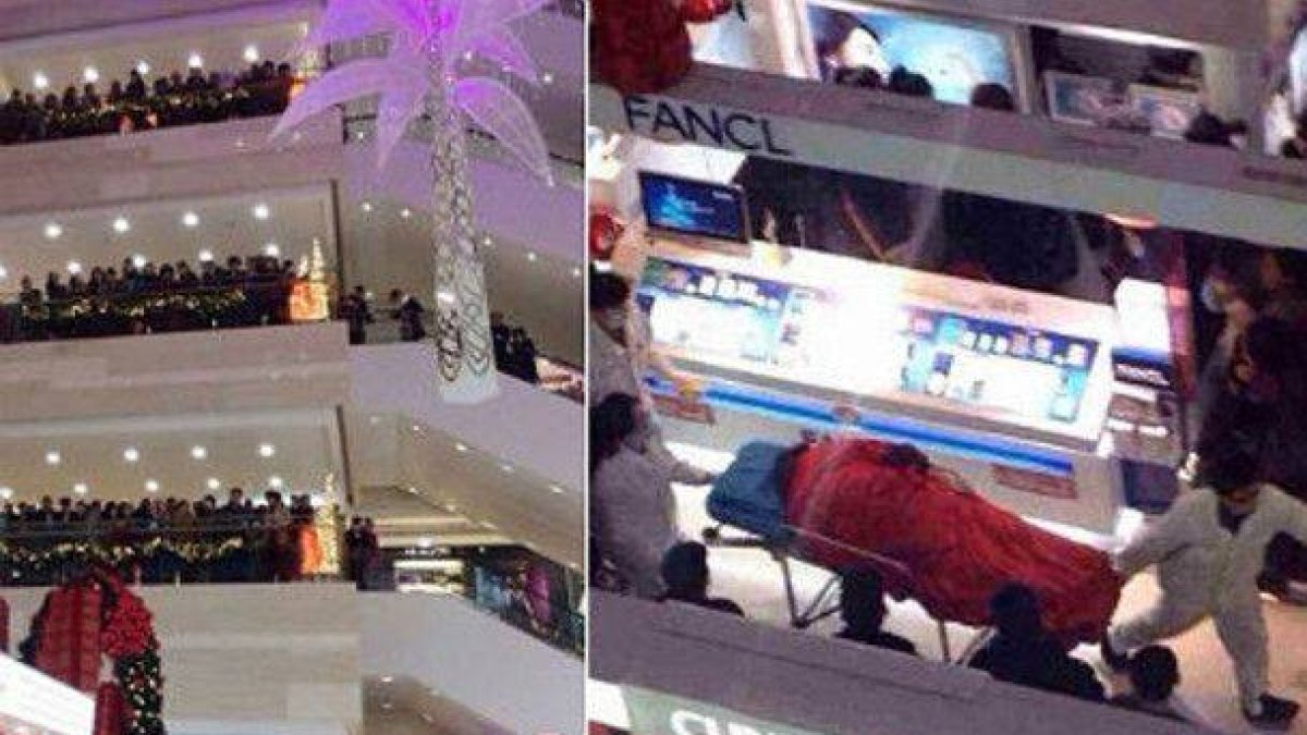 Aspecto del centro comercial Golden Eagle Internacional y del momento en que los camilleros se llevan el cuerpo de Tao Hsiao.
