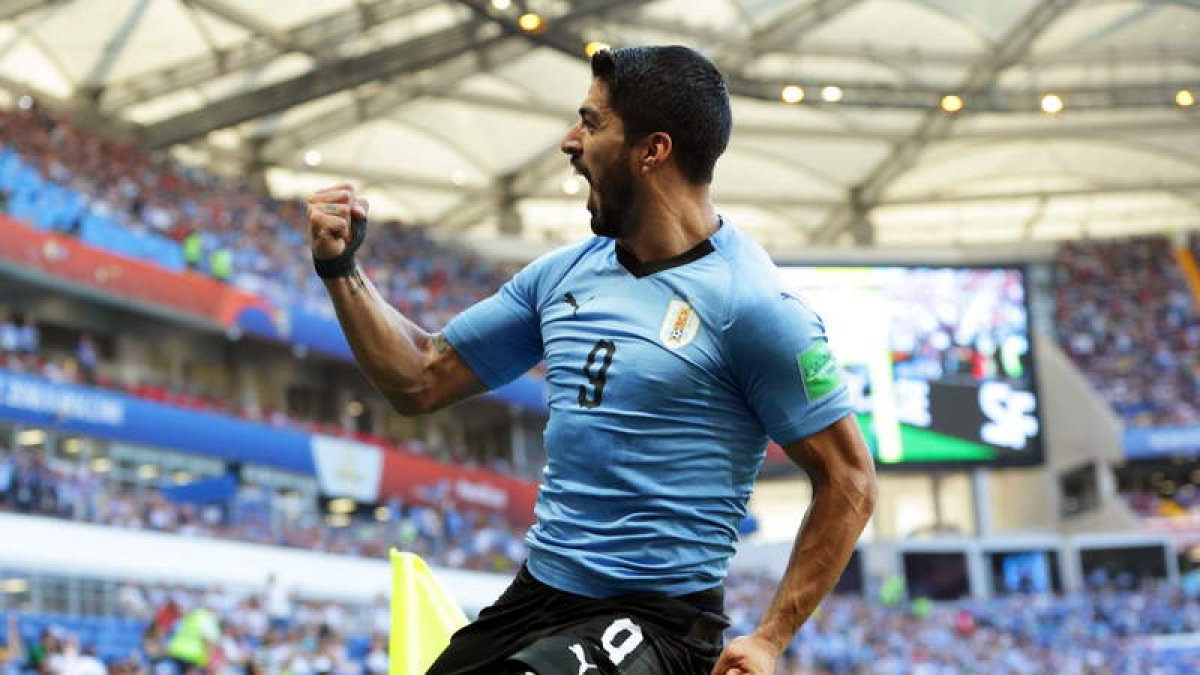 Suárez celebra con rabia el único gol de Uruguay. SHAWN THEW