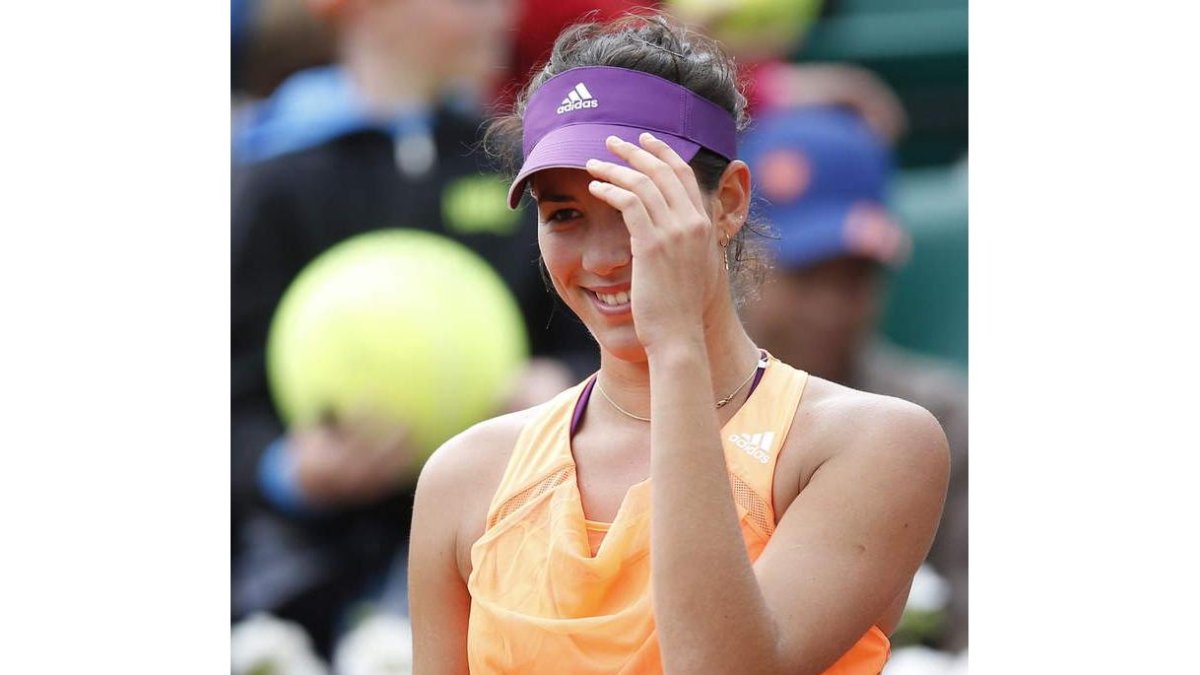 Muguruza, incrédula, celebra su victoria ante Williams.