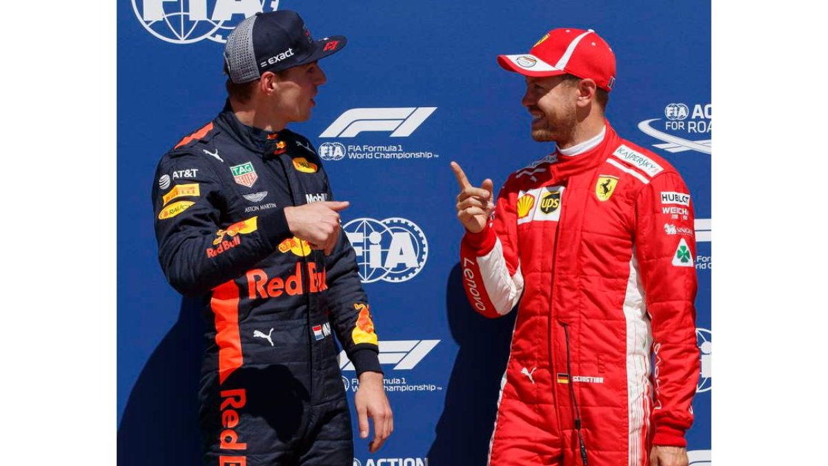 Vettel conversa con Verstappen tras lograr la pole. VALDRIN XHEMAJ