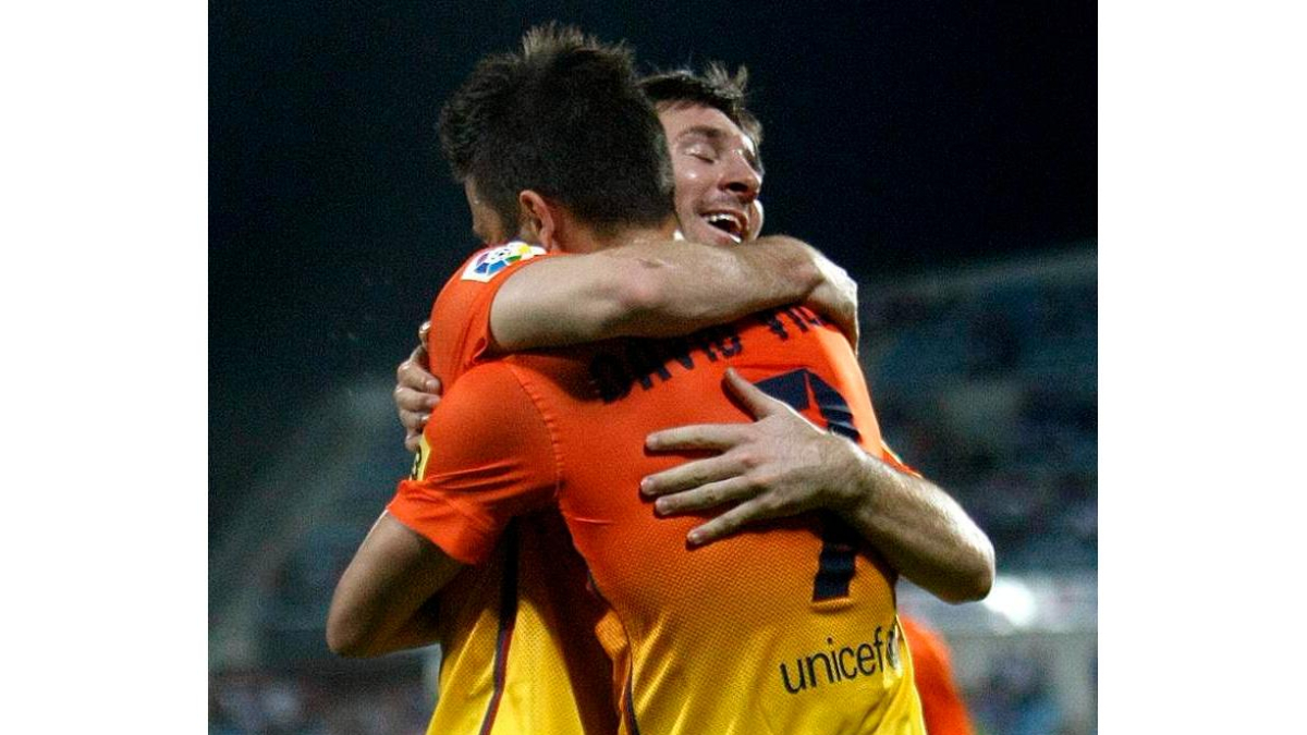 David Villa celebra con su compañero Leo Messi el gol marcado por el asturiano ante el Getafe.