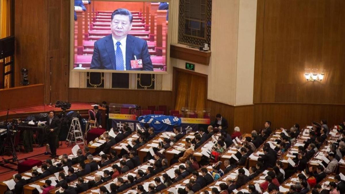 Una pantalla gigante muestra al presidente Xi Jinping durante la cuarta sesión plenaria de la XIII Asamblea Nacional Popular china, en el Gran Palacio del Pueblo, en Pekín, el 13 de marzo.