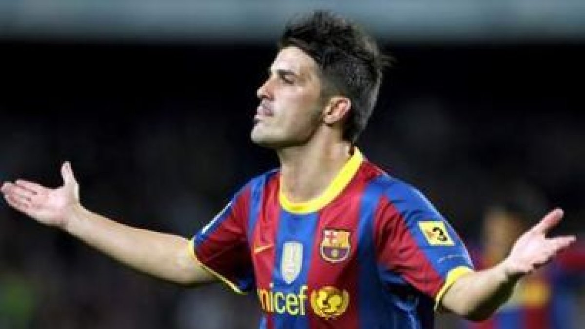 Villa celebra el primero de los dos goles que consiguió frente al Sevilla en el Camp Nou.