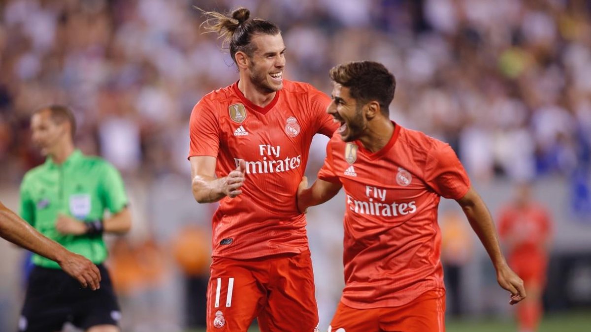 Bale (i) y Asensio celebran uno de los goles ante la Roma.