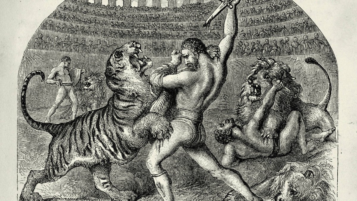 Ilustración de época victoriana (1860s) que recrea a bestiarii, gladiadores especializados en luchar contra fieras, enfrentándose a tigres y leones en el Coliseo de Roma. Escenas como esta eran habituales en las venationes, los espectáculos matutinos del circo romano.