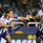 Filipe Luis celebra con su compañero Bodipo el pase.