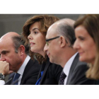 Luis De Guindos, Soraya Sáenz de Santamaría, Cristóbal Montoro y Fátima Báñez tras el Consejo de Ministros.