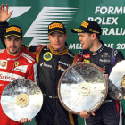 Raikkonen, en el podio, junto a Alonso, segundo, y Vettel, tercero.