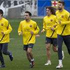 Cuenca, Xavi, Puyol y Piqué, durante el entrenamiento del Barcelona.